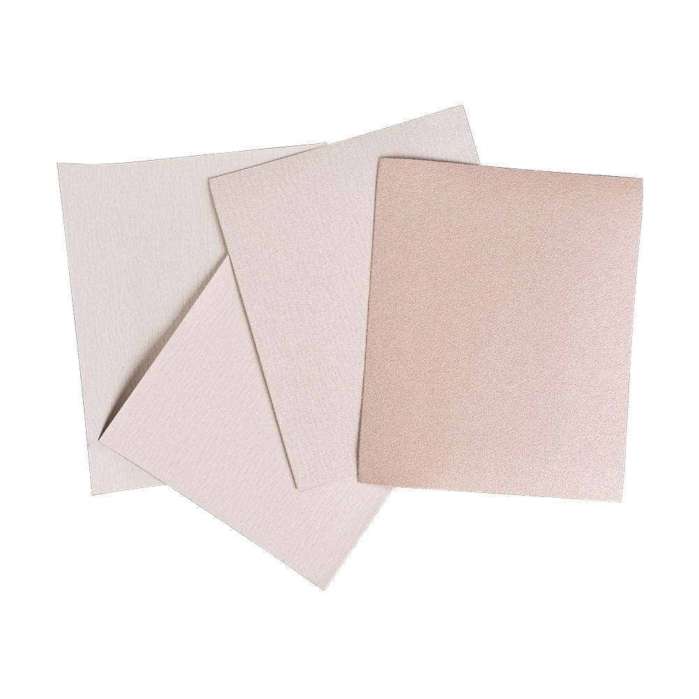 A stack of three Hermes sandpaper sheets, with one sheet partially separated from the stack.